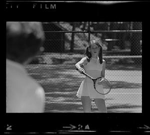 Young woman plays tennis