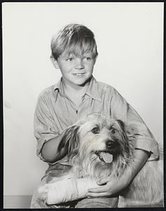 Lee Aaker Makes Ford Theater Debut in "And Suddenly You Knew" December 10. Young Lee Aaker will make his Ford Theatre debut when he stars opposite Teresa Wright and Ronald Reagan in "And Suddenly You Knew" on Thursday, December 10, at 9:30 P.M. (EST) over the NBC-TV network. Lee is shown here with dog star Chris who suffers from a broken leg in the telefilm. This program will also be seen on the following stations at different time and day: