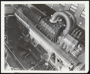 Giant Turbine Generator -- This modern counterpart of the early generaots at Niagara is one of the world’s largest single shaft turbine-generators. It weighs 1100 tons and in one year can generate 1,006,000,000 kilowat-hours of electricity.