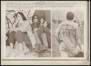 At the Peace Demonstration -- Most wore conventional clothes to today's peace demonstration in New York City. But others demonstrated a flair for the bizarre. Youth at right wears shirt proclaiming it's from the Ft. Lauderdale (Florida) jail. Girl at left wears newspaper hat, no shoes. Behind her, another girl is smoking a pipe.