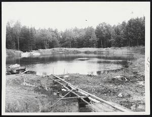 Continued Drought has prompted many farmers in Maine to develop ponds on their property. This private pond on the Arthur Bucknell farm, Denmark, Me. saved this farmer's 25 acres of strawberries and sweet peas.