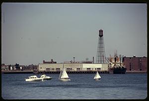 Boats passing by East Boston Pier No. 1