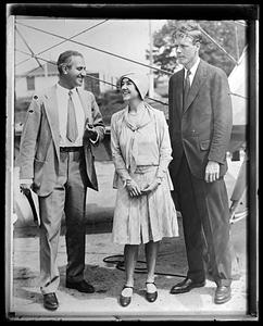 Charles and Anne Lindbergh speaking with another person