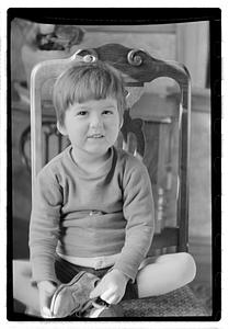 Toddler sitting on a chair