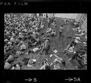 Boston Globe photographer Paul Connell covers a demonstration, Boston