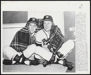 Braving the Cold-It was pretty chilly here early this morning, with temperatures in the 50's, as batterymen of the Milwaukee Braves reported for first official drill and southpaw pitchers Warren Spahn, left, and Chet Nichols bundled under a blanket to cope with the weather outside clubhouse. Spahn, of Hartshorne, Okla., had another good season in 1956, winning 20 against 11 losses. He had a 2.79 earned run average. Nichols, of Pawtucket, R.I., is up for another trial with club. He had combined 2-5 record at Milwaukeee, Whichita and Atlanta last season.