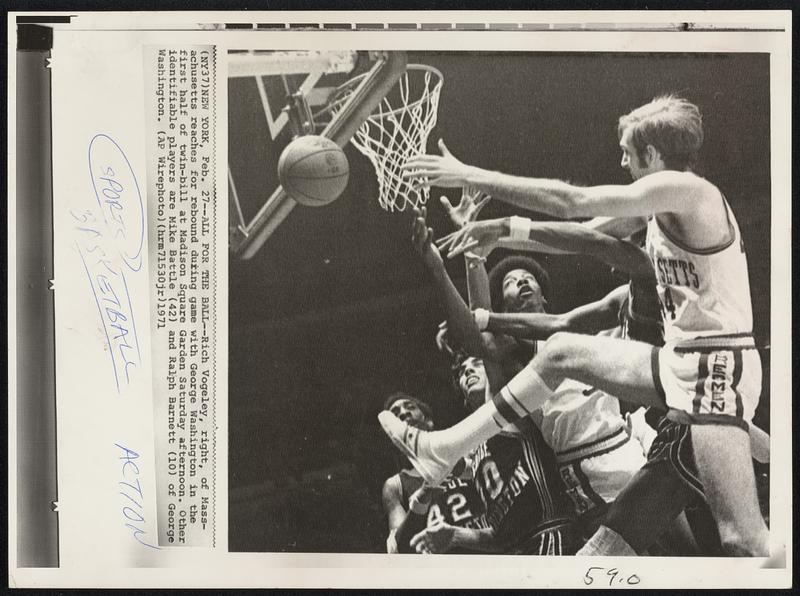 All For The Ball -- Rich Vogeley, right, of Massachusetts reaches for rebound during game with George Washington in the first half of twin-bill at Madison Square Garden Saturday afternoon. Other identifiable players are Mike Battle (42) and Ralph Barnett (10) of George Washington.