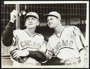 No Need Of Sun Glasses, because, in the past two games, the sun hasn’t been shining for the Chicago Cubs. Nevertheless, Jim Gleeson (left) and Glen Russell are ready for brighter days for the Chicago athletes as they wind up their series with the Bees at National League field.