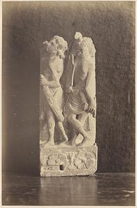 Stone carving of two boys