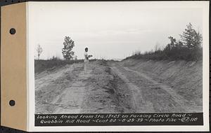 Contract No. 82, Constructing Quabbin Hill Road, Ware, looking ahead from Sta. 13+25 on parking circle road, Ware, Mass., Aug. 29, 1939