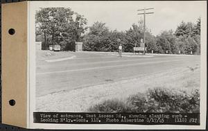 Contract No. 118, Miscellaneous Construction at Winsor Dam and Quabbin Dike, Belchertown, Ware, view of entrance, west access road, showing slanting curb, looking easterly, Ware, Mass., Aug. 17, 1945