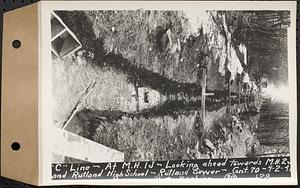 Contract No. 70, WPA Sewer Construction, Rutland, "C" line, at manhole 1J, looking ahead towards manhole 2 and Rutland High School, Rutland Sewer, Rutland, Mass., Apr. 2, 1941