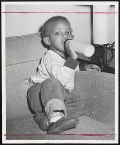 Only 17 Months Old, Russell Sanders doesn't know that his father, Ed, died of a brain injury in the heavyweight fight at the Boston Garden. The baby merely knows that his father hasn't returned to the home in the D street project in South Boston.