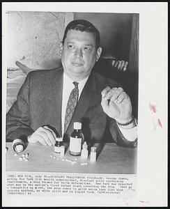 Displays Thalidomide Pills-Dr. George James, acting New York City health commisisoner, displays pills containing thalidomide, a drug blamed for birth deformities. New York has reported what may be the nation's first infant death involving the drug. Used as a tranquilizing agent, the drug comes in pills which look like blue aspirin tablets, as white pills and in liquid form.