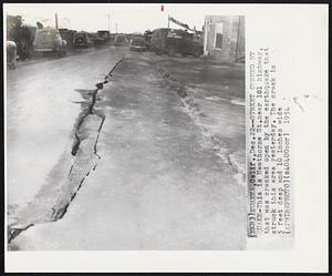 Street Opened by Quake-This is Hawthorne St. near 101 highway, that was cracked open by the earthquake that struck this area yesterday. The crack is 5 feet deep and 10 inches wide.