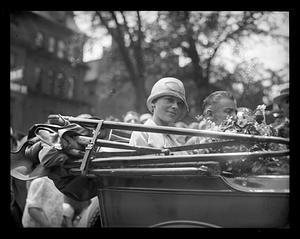 Amelia Earhart sits in car