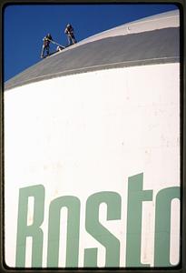 Boston 1985: Workers on top of a Boston Gas gas tank in Dorchester
