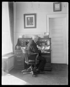 Man seated at desk