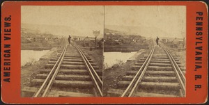 Man standing on railroad tracks