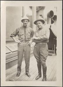 Two men standing on a ship deck