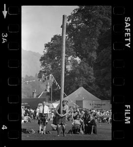 Man in kilt readys caber for caber toss
