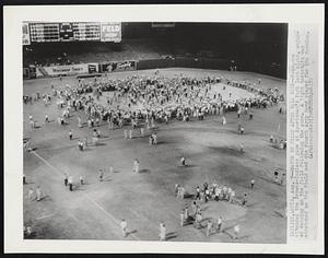 Dance on Field After Ball Game--Fans,who attended the Browns-Indians game at Sportsman’s Park last night, enjoyed dancing on the field following the game. A tight tarpaulin was stretched on the field and the Fourth Army bank played for the dancing.