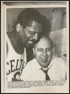 Victory Shower-- Bill Russell (left) of the Boston Celtics as he holds his coach "Red" Auerbach under shower after they had defeated the Los Angeles Lakers 95 to 93 to win their eighth straight National Basketball Association Championship at Boston Garden tonight.