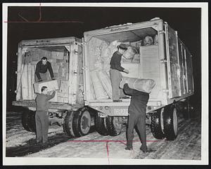 Moving Motor Freight on trucks of Pilgrim Transport, Inc., Cambridge, which signed a temporary contract with Local 25 granting $65 for a 40-hour week. The Cambridge concern is one of a group of 40 that has come to terms with the teamsters and whose trucks are moving without interruption.