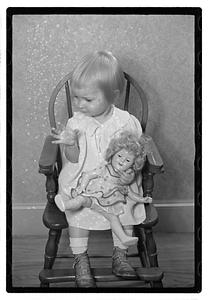 A girl holding a doll