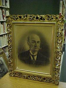 Photographic portrait of a mustachioed man