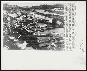 Okinawa Typhoon Damage-This is the wreckage of a guest house at headquarters, Ryukyu command, on Okinawa Island in the Pacific, after a typhoon struck July 23. This radiophoto, released in Washington today by the National Military Establishment, is the first picture received on the Okinawa storm which left two dead, injured 16 Americans and did $20.000.000 unofficially estimated damage to American installations.