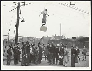 Stuffed figure hanged in effigy in Everett, following clash between seamen's strike pickets and police near an oil plant.