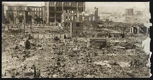 Where the Power of Money Failed to Check Destruction Japan's Wall Street, the Financial District of Tokio, Presents the Same Scene of Devastation as Other Parts of the Capital City. After the Earthquake Came the Fire, Finding Ready Fuel in the Ruins of the Wrecked Buildings. Photo Shows the Ruins of the Marunduchi, or Financial District of Tokio.