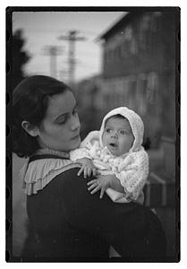 Mercedes Pasarell Sanromá holding a baby
