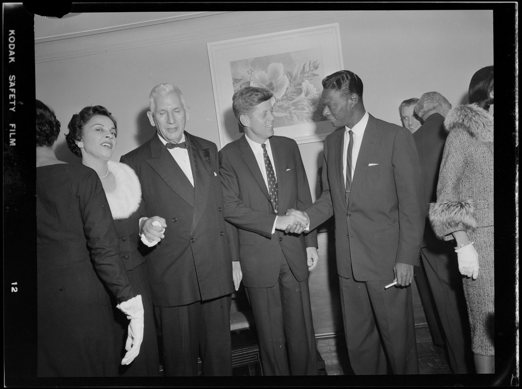 JFK shakes hands with Nat King Cole as Mrs. Cole and Sen. Paul Douglas look on, 1956 Democratic National Convention