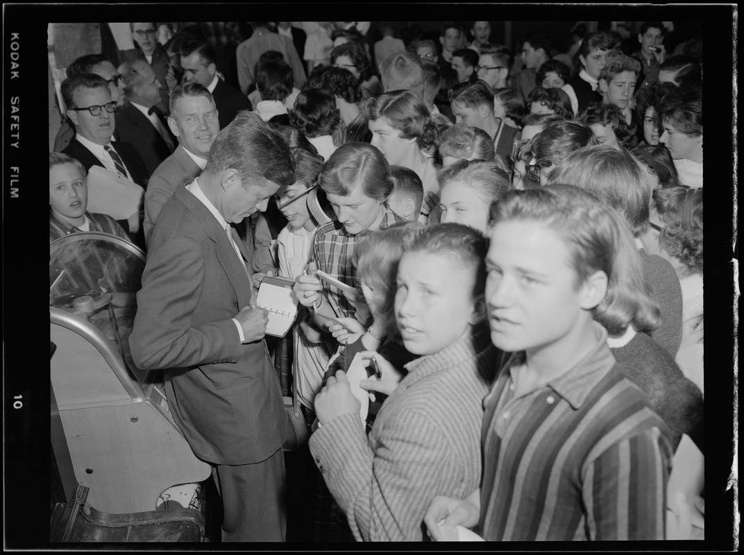 JFK signs autographs during Senate campaign