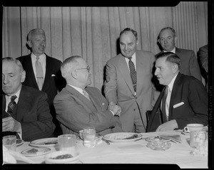 Truman, flanked by Curley & Furcolo, shakes hands during his breakfast at the University Club