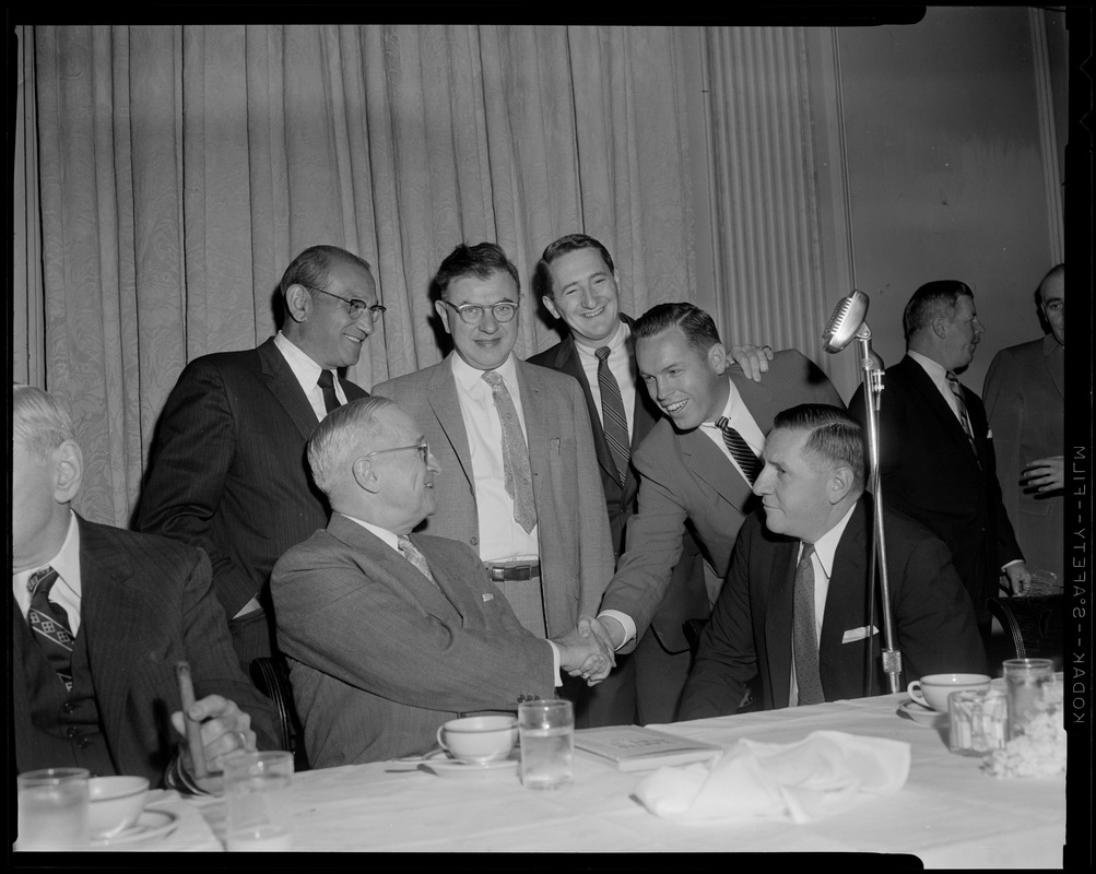 Truman, flanked by Curley & Furcolo, shakes hands during his breakfast at the University Club