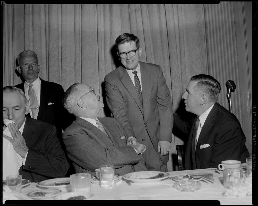 Truman, flanked by Curley & Furcolo, shakes hands during his breakfast at the University Club