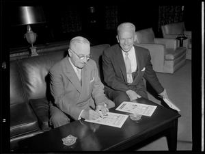 Truman signs autographs at University Club