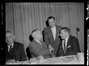 Truman with Furcolo & J. M. Curley shaking hands at Gov. Furcolo's breakfast for Truman at the University Club