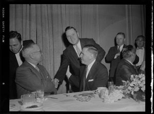Truman shaking hands at Gov. Furcolo's breakfast for Truman at the University Club