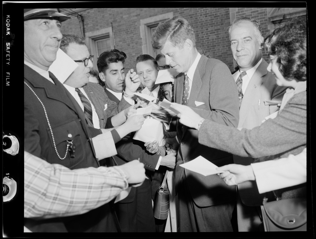 JFK signing autographs during Senate campaign