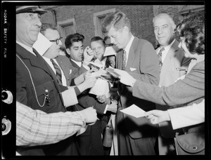 JFK signing autographs during Senate campaign