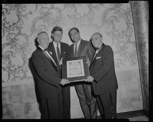 JFK receives plaque as the Sons of Italy "Man of the Year"