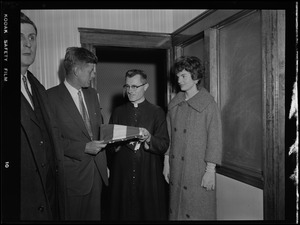 JFK & Jackie receive flag from priest during Senate campaign