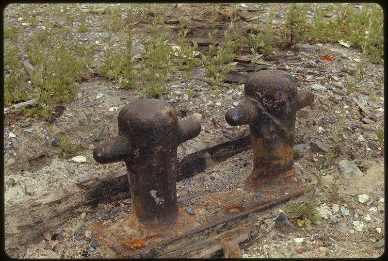 Two rusty cleats