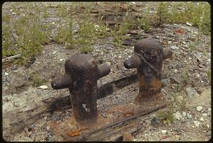 Two rusty cleats