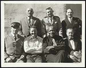Famous Heroes of Yesterday--Here are some of the outstanding sport luminaries of the past collected by Paramount to appear with Jack Oakie in "Madison Square Garden." Standing, left to right: Stanislaus Zbyszko, Billy Papke, Tommy Ryan. Seated: Tommy Sharkey, Jack Oakie, Jack Johnson and Tod Sloan.