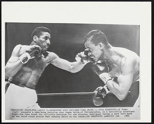 Rodriguez Wins Decision over Smith--Luis Rodriguez, of Miami (left) danced to a unanimous decision over Jesse Smith, of Philadelphia, in a nationally televised fight. The fans booed the officials decision for ten minutes. Rodriguez throws a hard left hook in the third round action that catches Smith on the cheek.